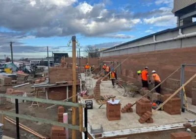 Brickwork progressing across a multi-level development site